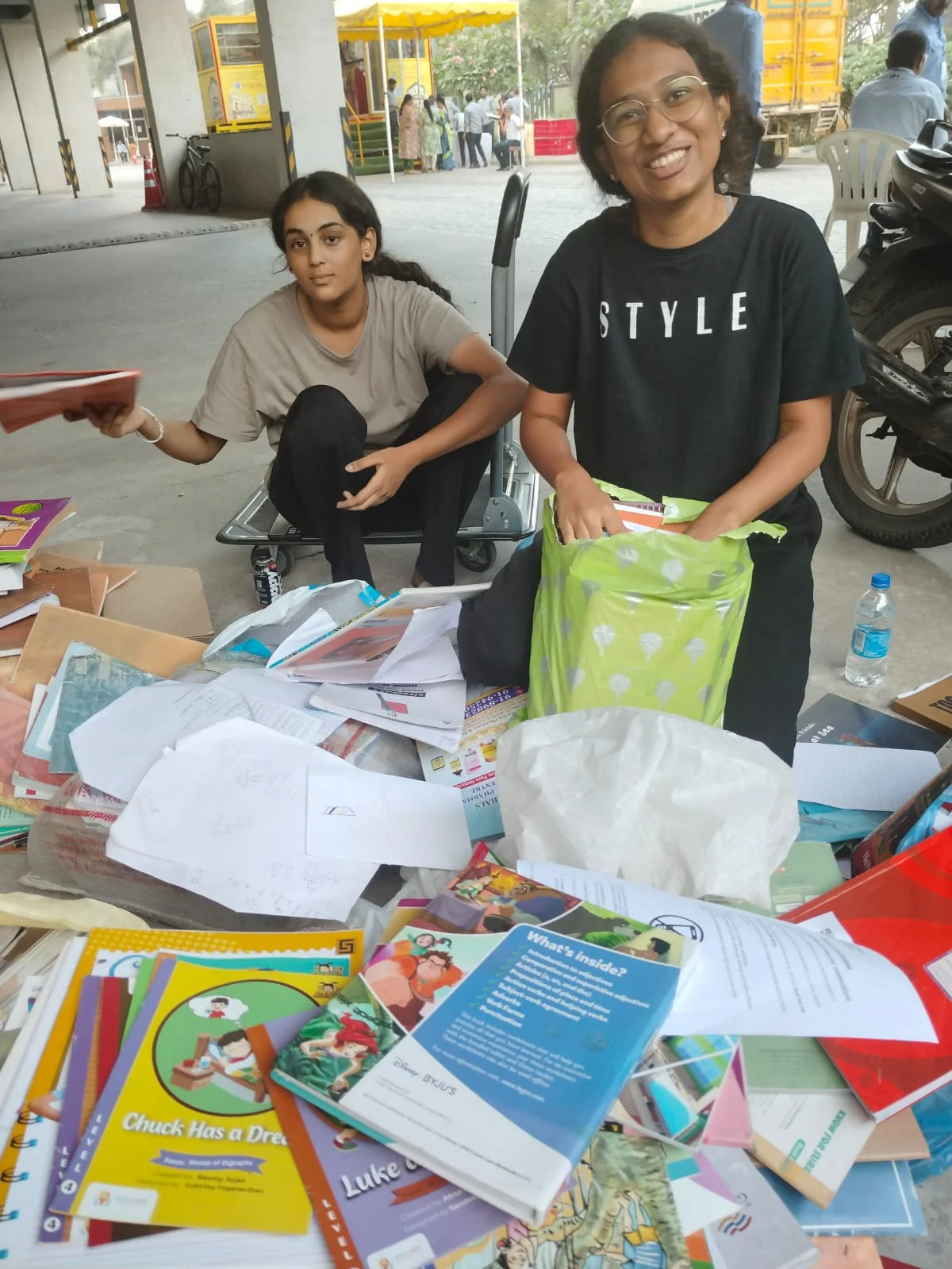 Volunteers sorting donated paper, books, and newspapers